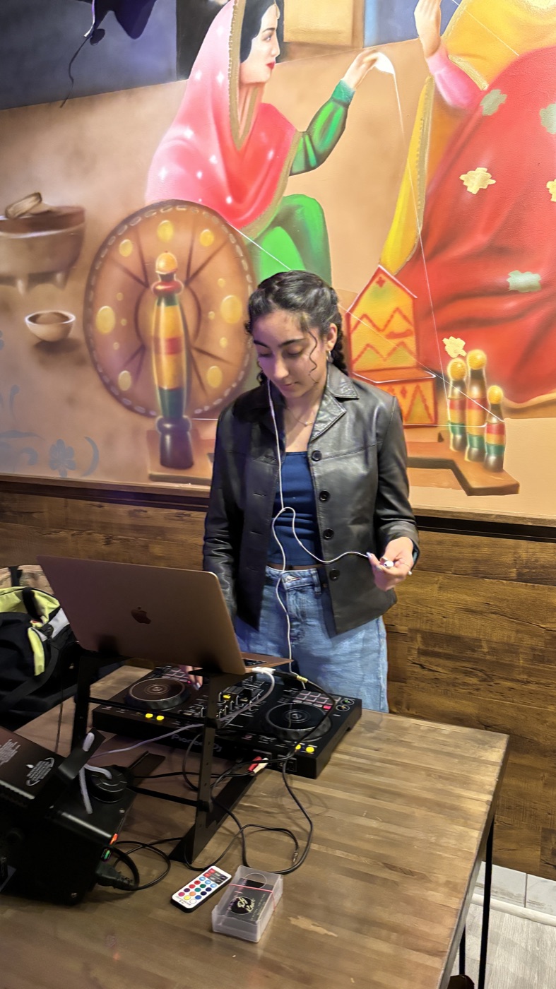 DJ Kaur at the decks at a birthday celebration