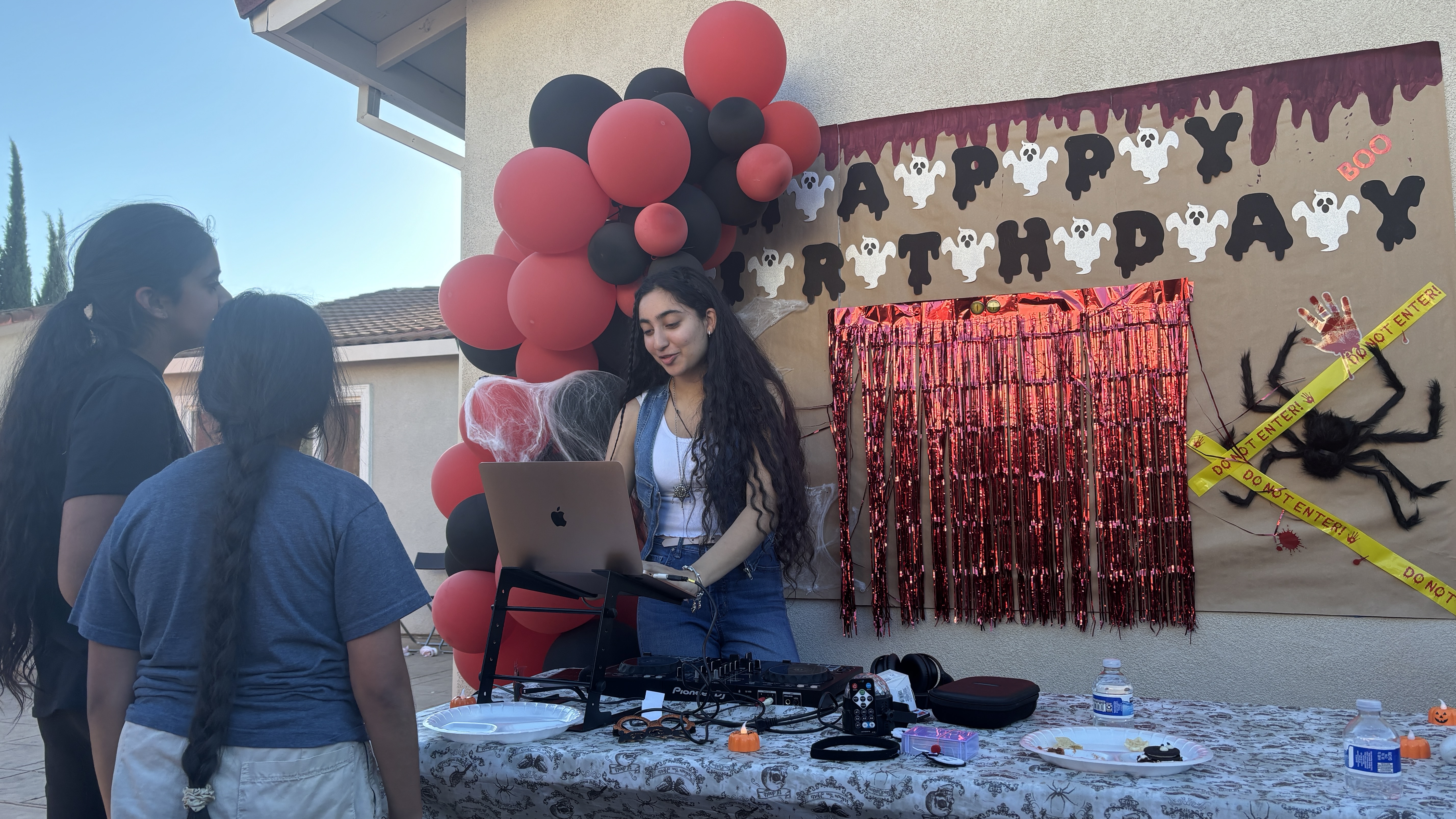DJ Kaur at the decks during an outdoor community event